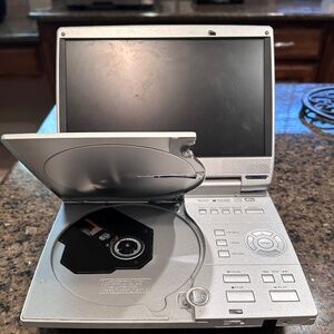 Vintage, Toshiba Portable DVD Player (safer than a tablet).